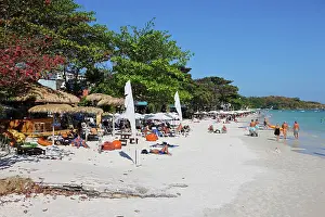 Scene: Tourists sunbathing on Sai Kaew beach on Koh Samet island in Thailand