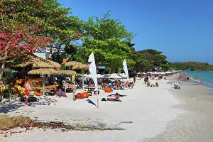 Scene: Tourists sunbathing on Sai Kaew beach on Koh Samet island in Thailand