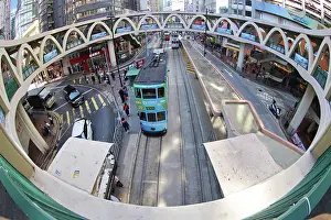 Hong Kong: Traditional Hong Kong electric tram at Yee Wo Street circular pedestrian bridge in Causeway Bay