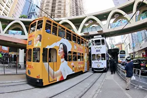 Hong Kong: Traditional Hong Kong electric tram at Yee Wo Street circular pedestrian bridge in Causeway Bay