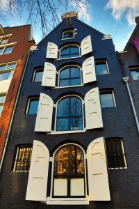 Netherlands: Traditional house with shutters on the windows in Amsterdam, Holland