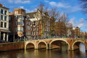 Netherlands: Traditional houses and a bridge over a canal on Herengracht in Amsterdam, Holland