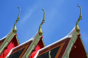 Golden: Traditional Thai architecture roof decorations at Wat Pho temple, Bangkok, Thailand