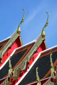 Golden: Traditional Thai architecture roof decorations at Wat Pho temple, Bangkok, Thailand