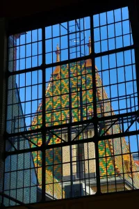 Budapest, Hungary: Traditional tiled roof seen through a metal framed window in Budapest, Hungary