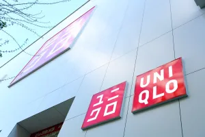 Shops: Uniqlo Shop and sign of logo in Shinjuku, Tokyo, Japan