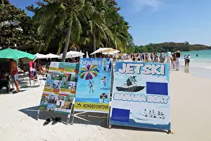 Scene: Watersports activities advertising boa rds on Sai Kaew Beach on Koh Samet island