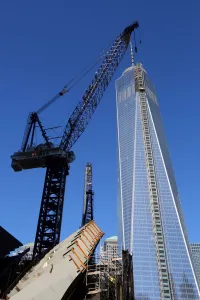 States: One World Trade Center ( 1 WTC ) building construction with crane, New York. America