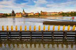 Museum: Yellow penguins art installation by the Cracking Art Group beside the Kampa Museum and Vtlava River